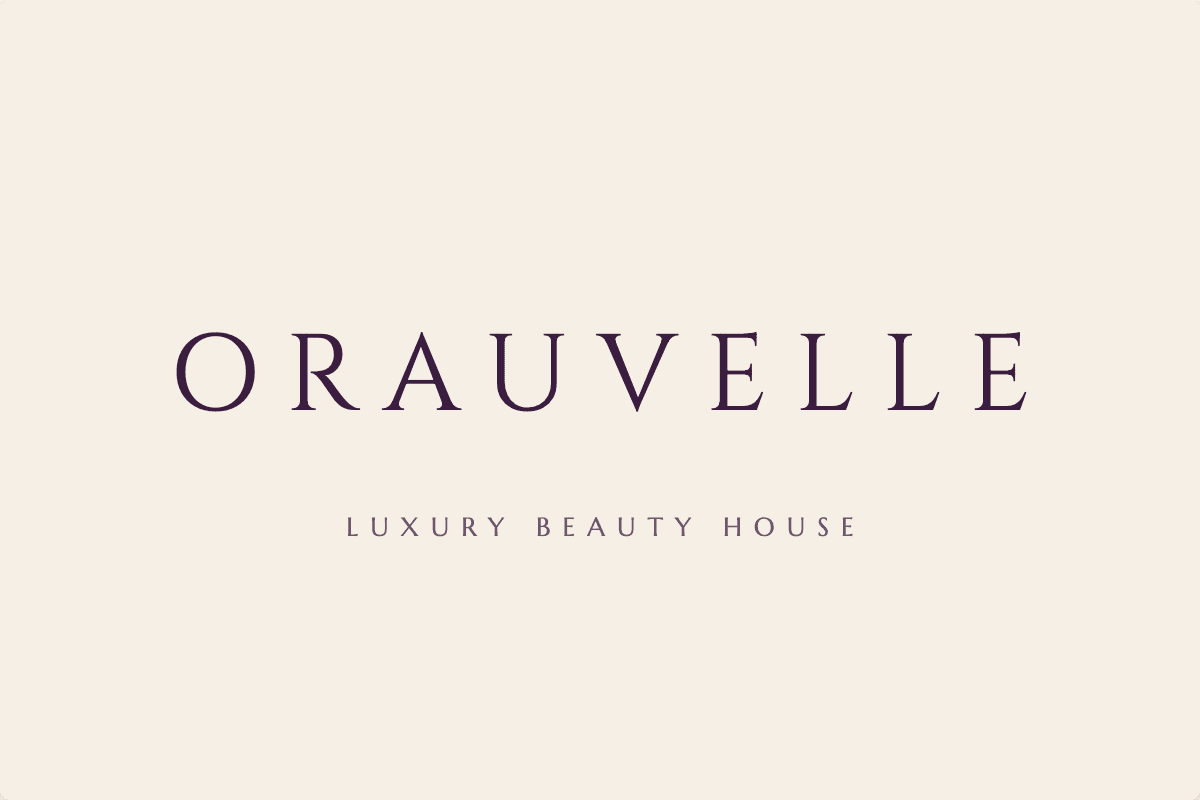 Orauvelle first logo concept 1: Classic wordmark, plum capitals on cream with a gold rule